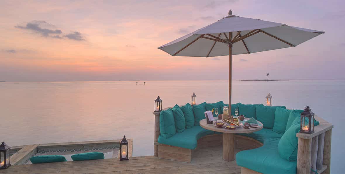Gili-lankanfushi-maldives-Over-Water-Bar-Outer-Deck-At-Sunset